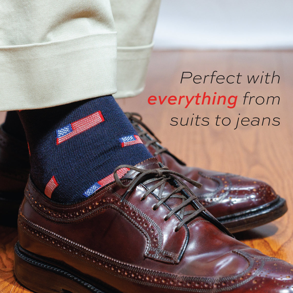 man wearing khakis and navy merino wool mid-calf american flag dress socks and nice shoes