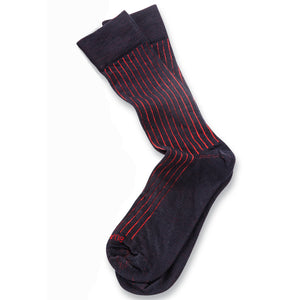 pair of navy and red shadow stripe dress socks atop a white table