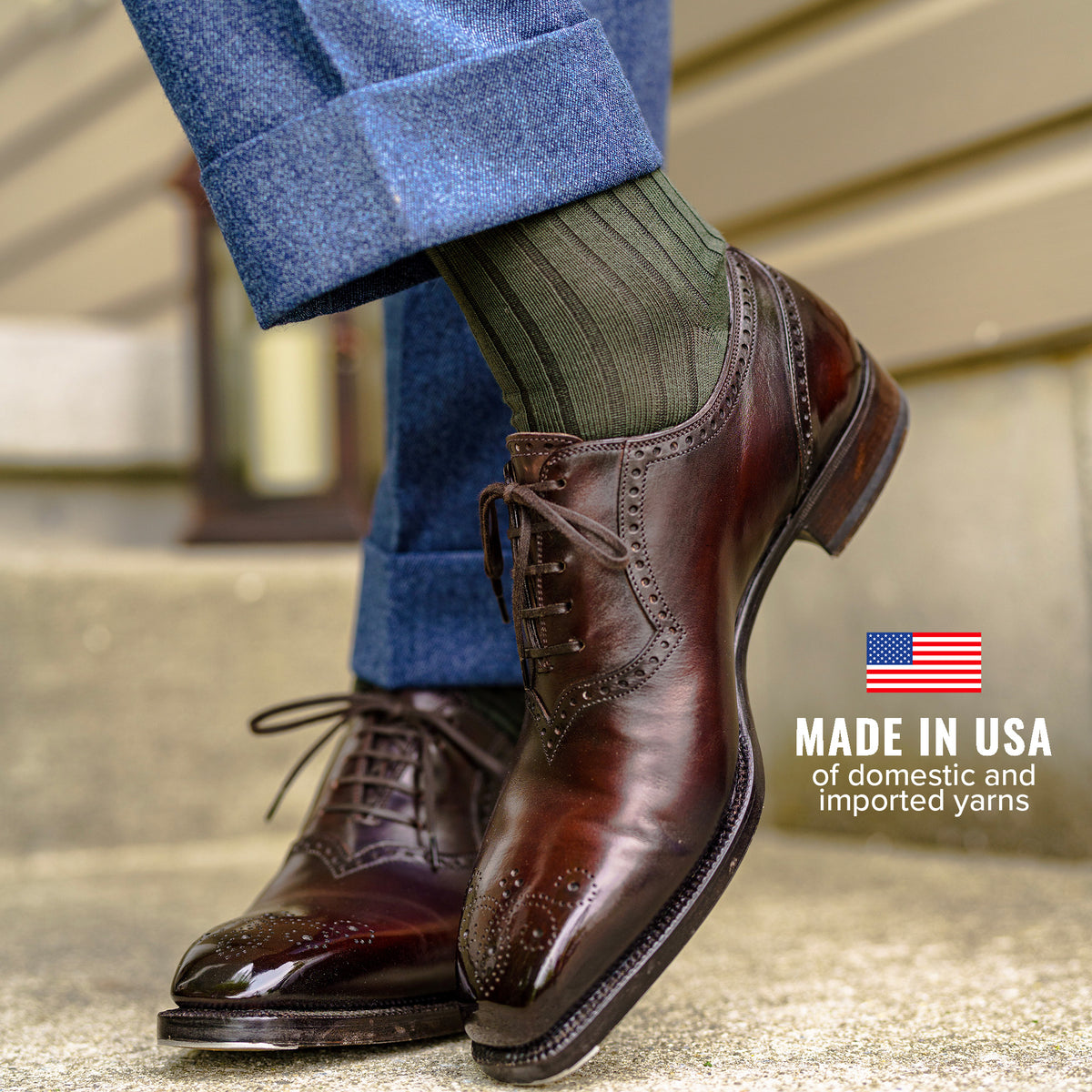 man wearing olive cotton dress socks with blue slacks and brown oxfords