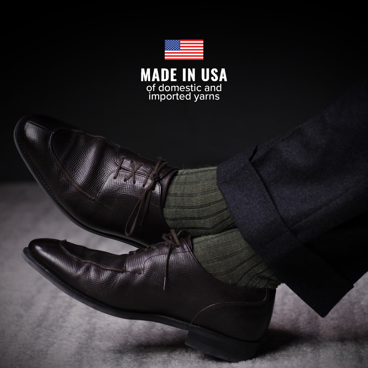 man wearing olive green merino wool dress socks with charcoal slacks and dark brown dress shoes