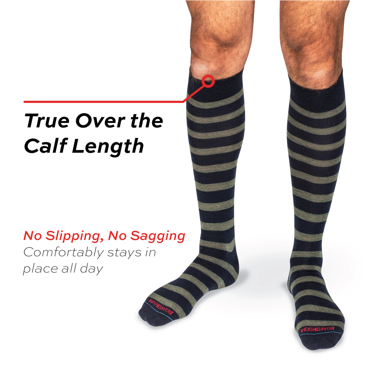 model standing wearing Olive Stripes on Navy Merino Wool Over the Calf Dress Socks on a white background