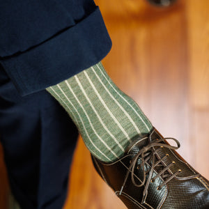 olive and tan ribbed shadow stripe socks with navy slacks and brown derbies