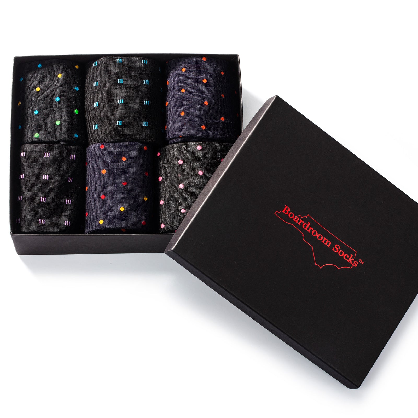 opened gift box showing six pairs of colorful patterned dress socks for men