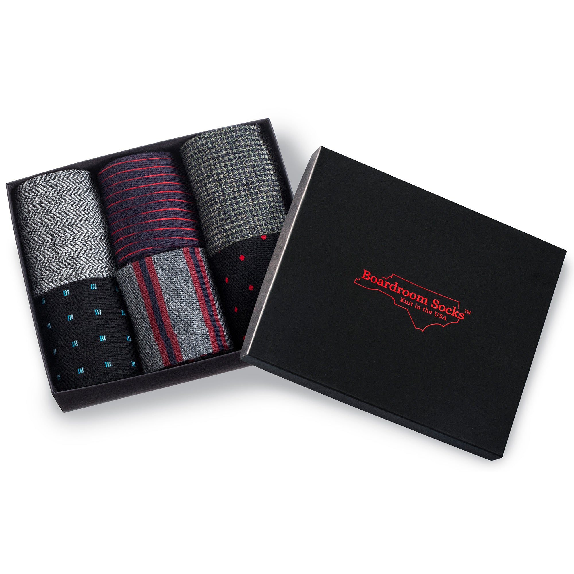 opened gift box filled with six pairs of patterned merino wool men's dress socks