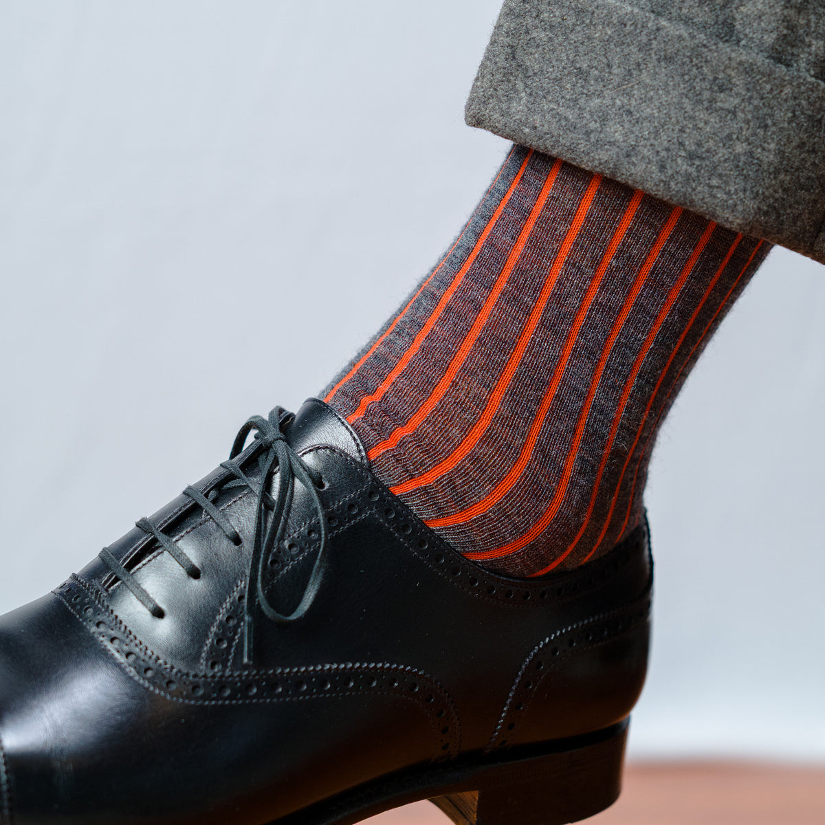 grey and orange shadow stripe dress socks with grey slacks and black oxfords