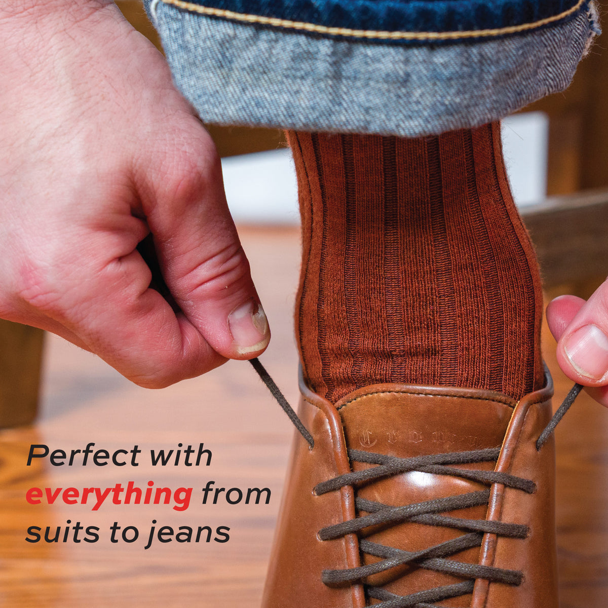 close up on man tying shoe wearing Burnt Orange Merino Wool Over the Calf Dress Socks