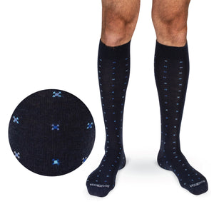 model wearing Navy Geometric Merino Wool Over the Calf Dress Socks on white background