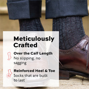 man standing wearing brown oxfords and grey over the calf merino wool ribbed dress socks