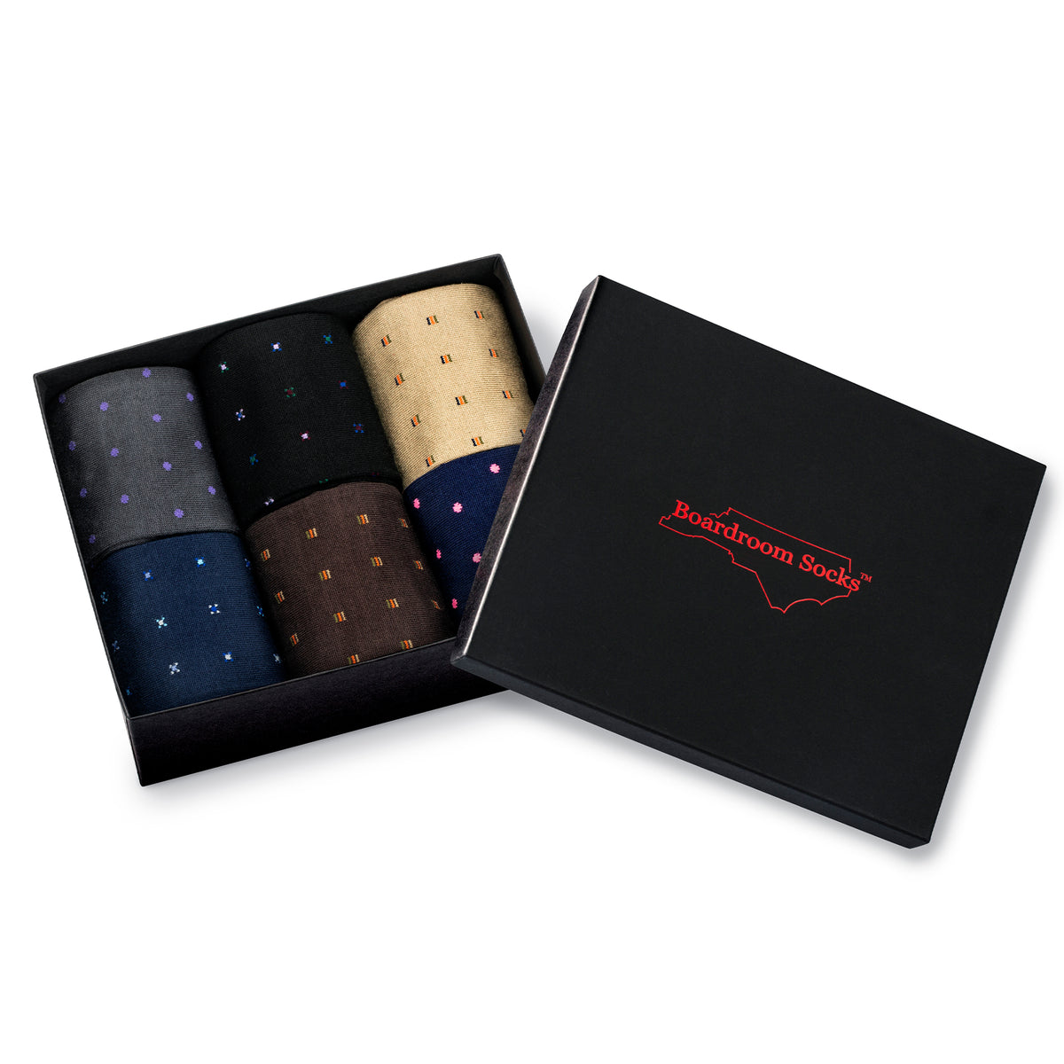 6 pairs of neatly rolled up cotton pattern dress socks tucked into a black gift box on a white background with a boardroom lid sitting to the right side of the box