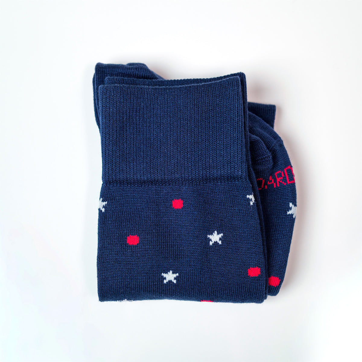folded pair of americana navy cotton dress socks on a white background
