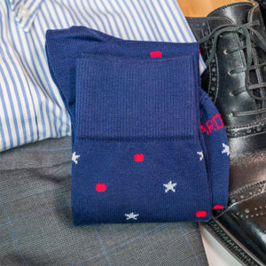 cotton star and dot patterned dress socks folded laying on top of clothing