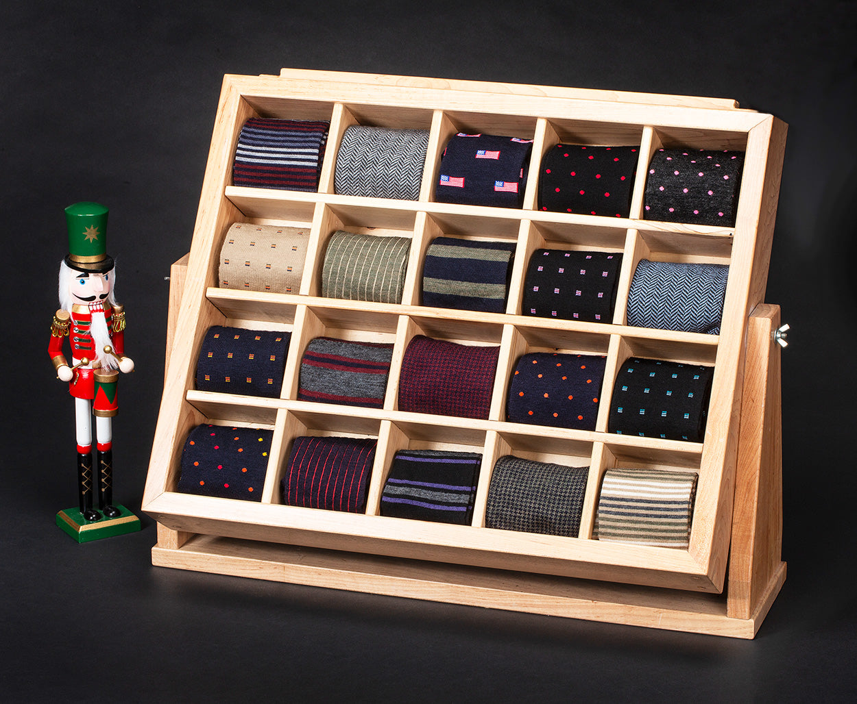 wooden display rack filled with colorful patterned dress socks from Boardroom Socks
