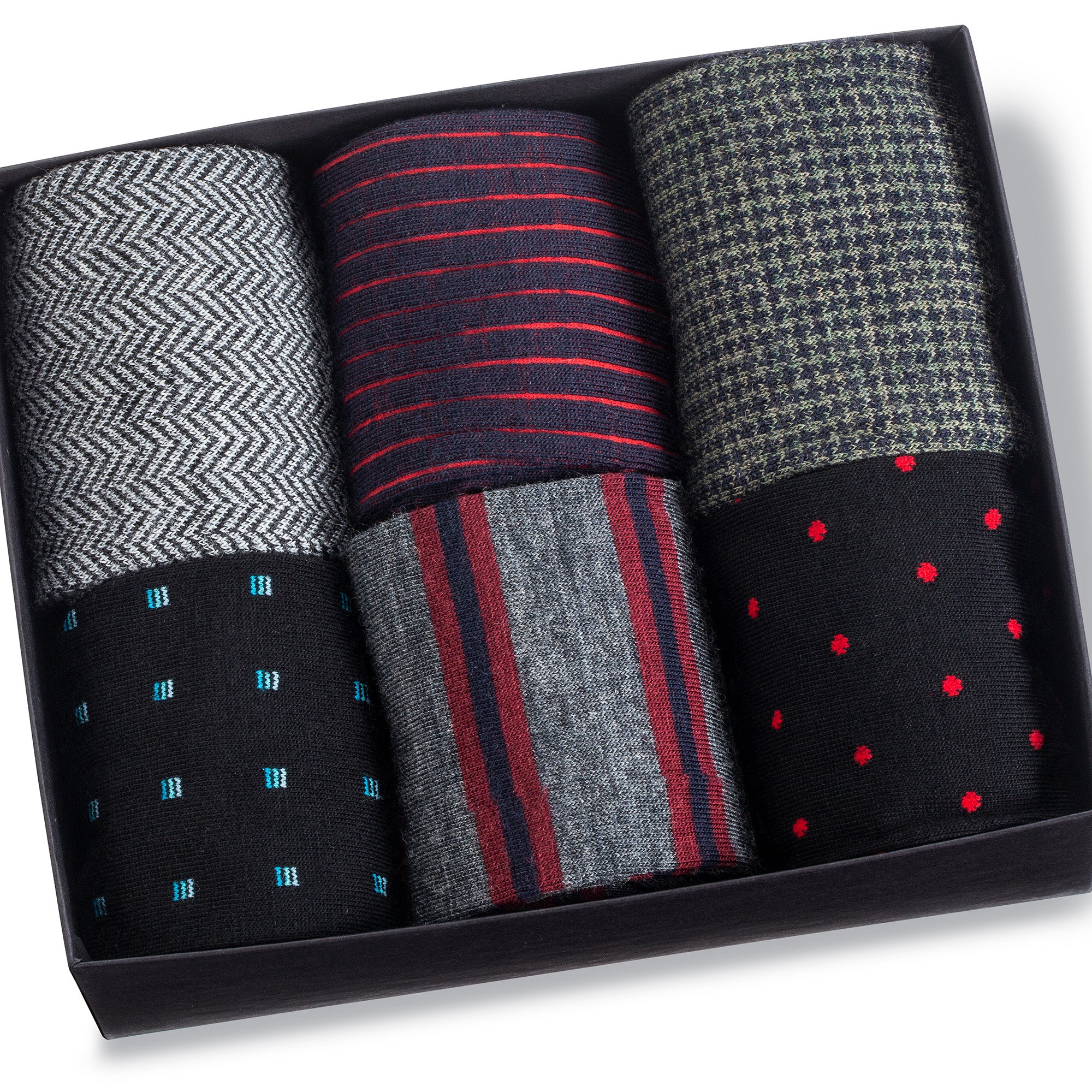 opened gift box with six pairs of patterned merino wool dress socks for men