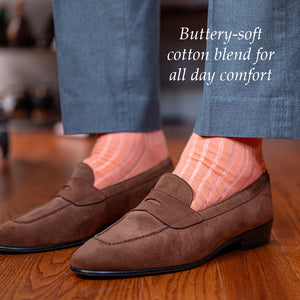 peach dress socks with light grey slacks and light brown suede penny loafers