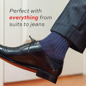 close up image of model wearing heather blue dress socks with 