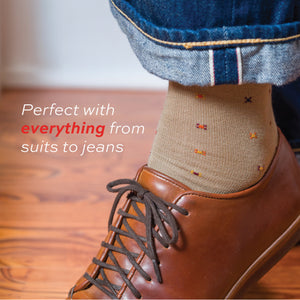 close up image of khaki merino wool dress socks being worn with brown lace up shoes