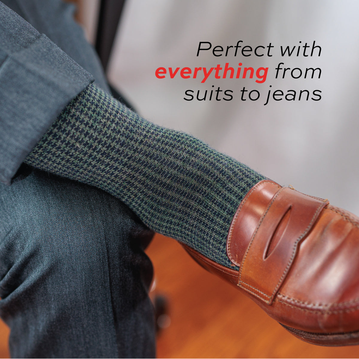 close up image of man wearing brown loafers and olive and navy houndstooth pattern dress socks