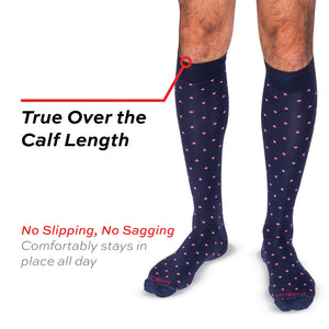 model wearing pink dots on navy cotton over the calf length socks with a no slipping, no sagging text overlay