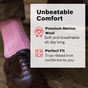 close up image of pink merino wool dress socks worn with brown pants and shoes