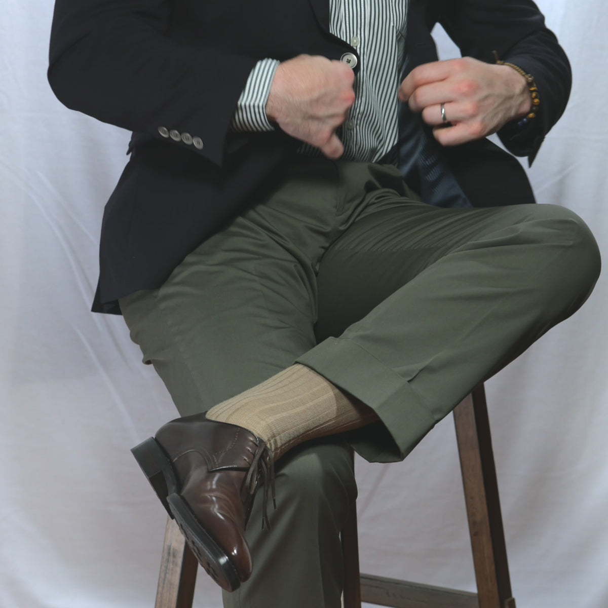 video of man putting on and wearing khaki merino wool dress socks from Boardroom Socks