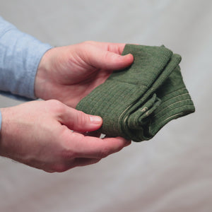 video demonstrating Boardroom Socks' olive and tan shadow stripe wool dress socks