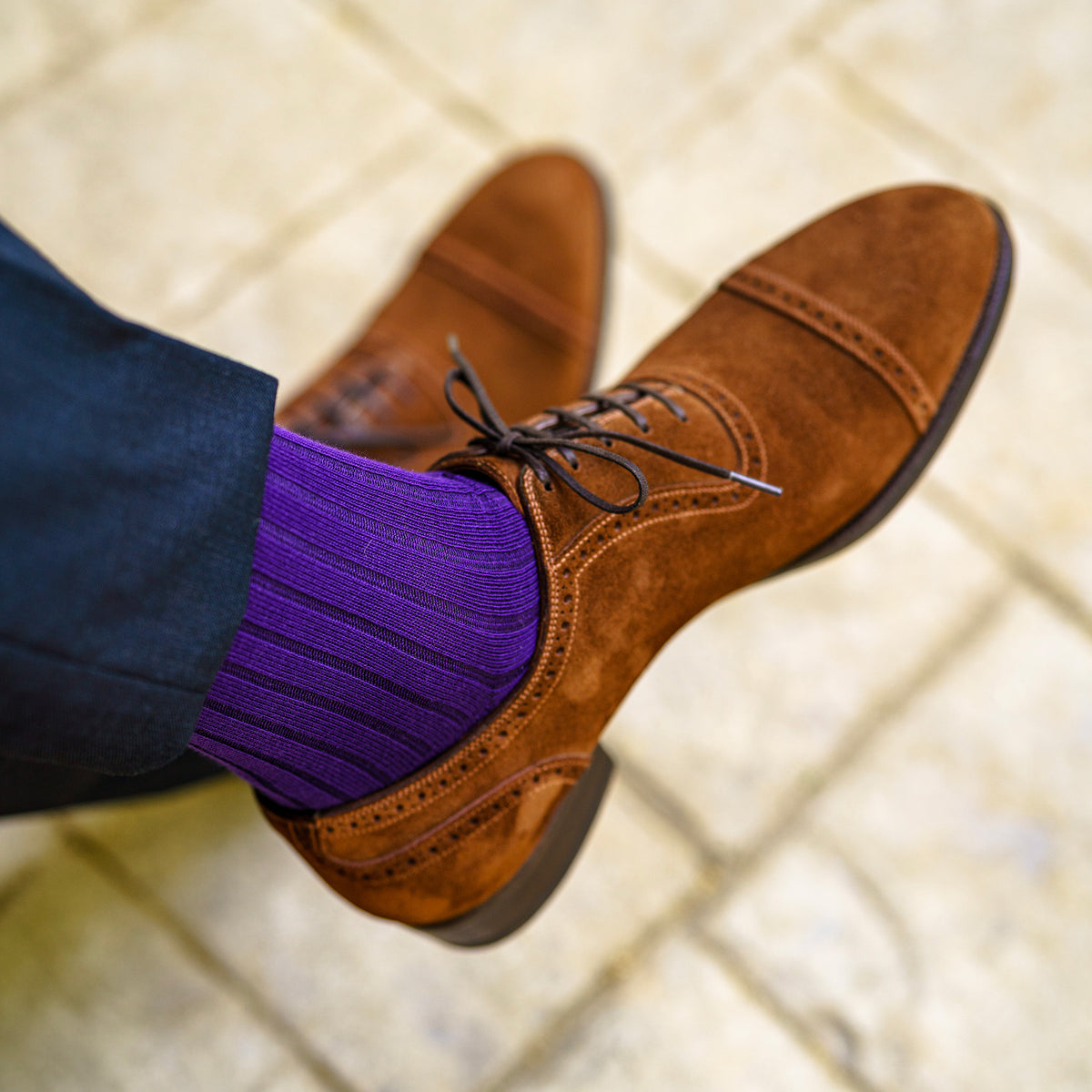 purple cotton dress socks paired with dark slacks and light brown suede shoes