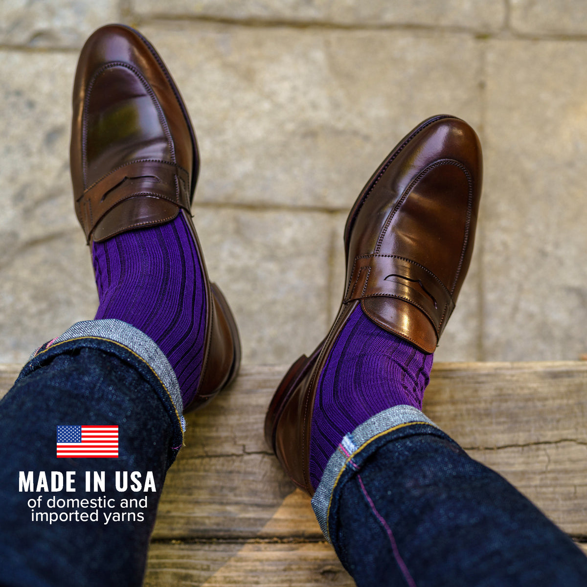 man wearing purple cotton dress socks with jeans and penny loafers