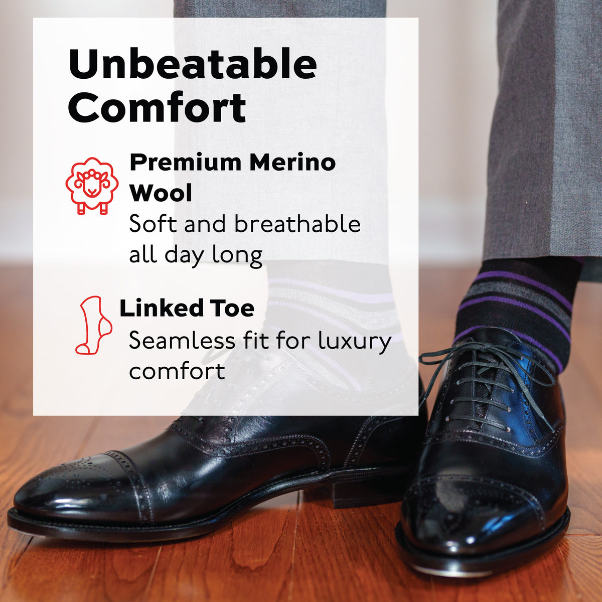 man standing on a hardwood floor wearing grey pants, black dress shoes and Purple and Grey Stripes on Black Merino Wool Over the Calf Dress Socks
