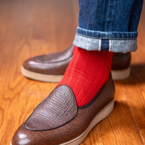 red ribbed dress socks with jeans and hip loafers