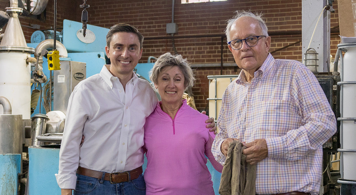 James family standing together in Boardroom Socks finishing plant