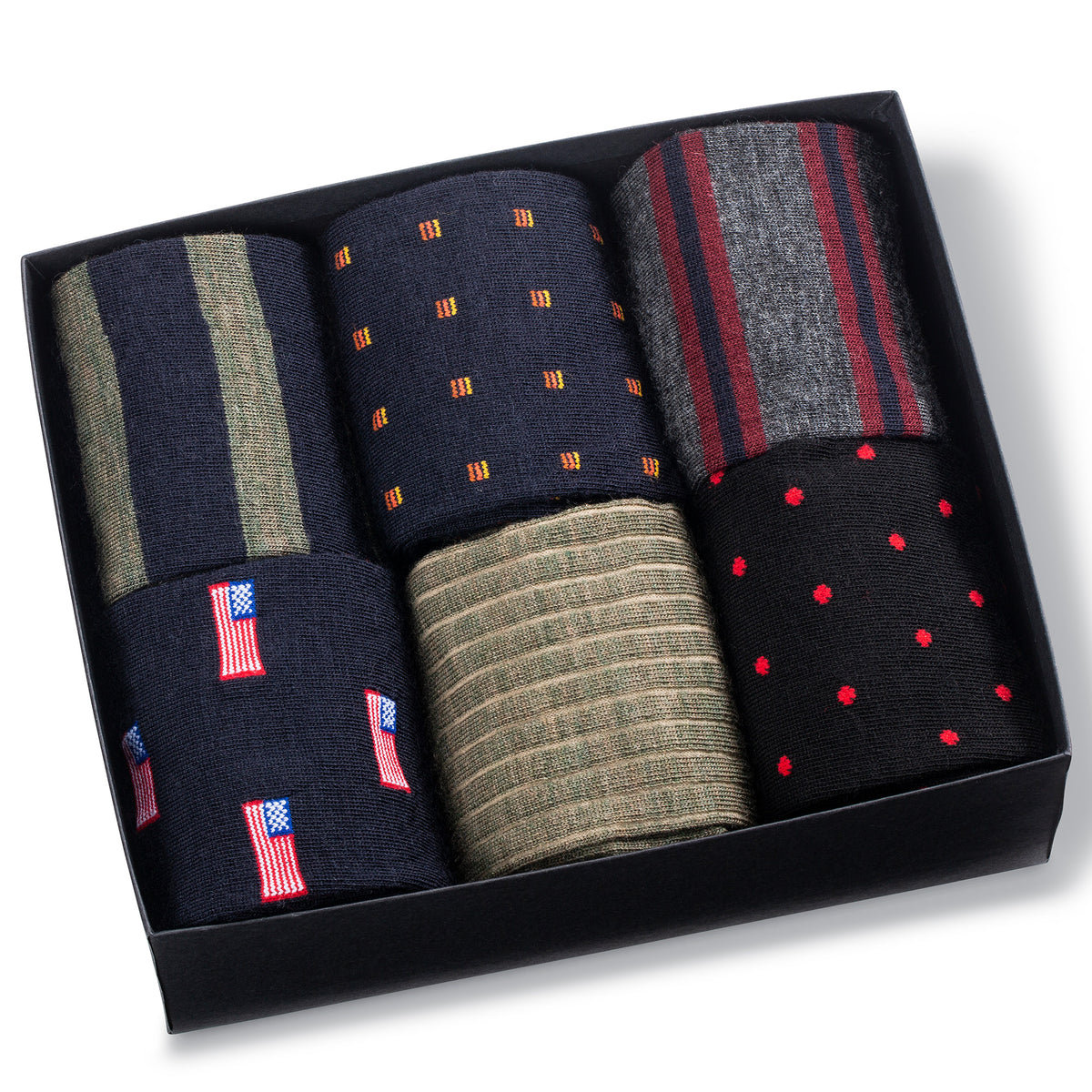 six pairs of colorful merino wool patterned dress socks in an opened Boardroom Socks gift box