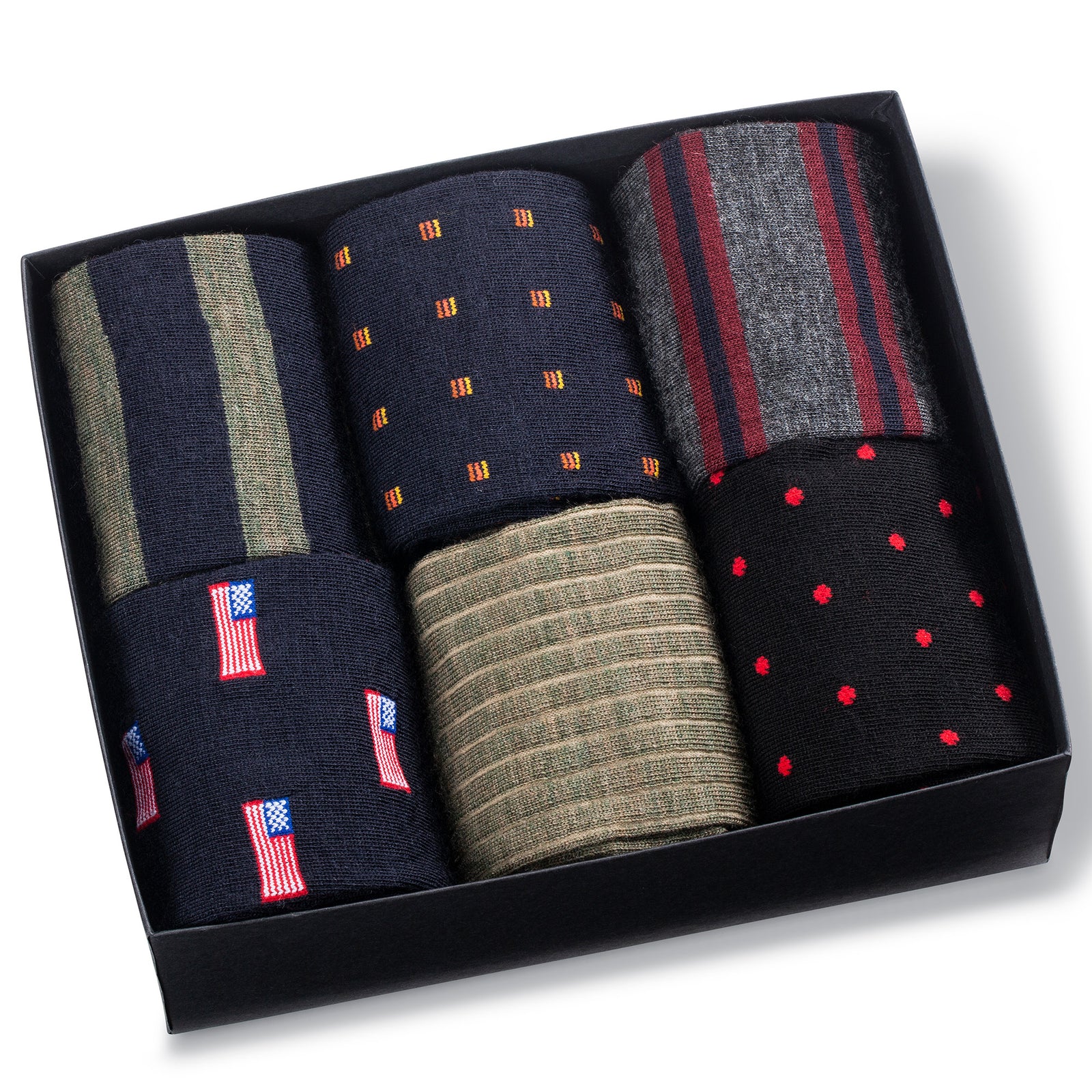 six pairs of colorful merino wool patterned dress socks in an opened Boardroom Socks gift box