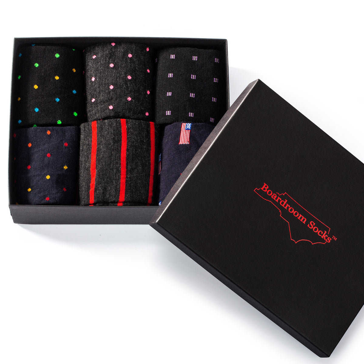 lid resting on top of opened gift box filled with colorful patterned dress socks for men