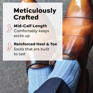man crossing his feet wearing sky blue mid-calf length merino wool dress socks with infographic overlay