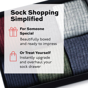 photo of a gift box of 6 different color over the calf wool solid dress socks with treat yourself text overlay