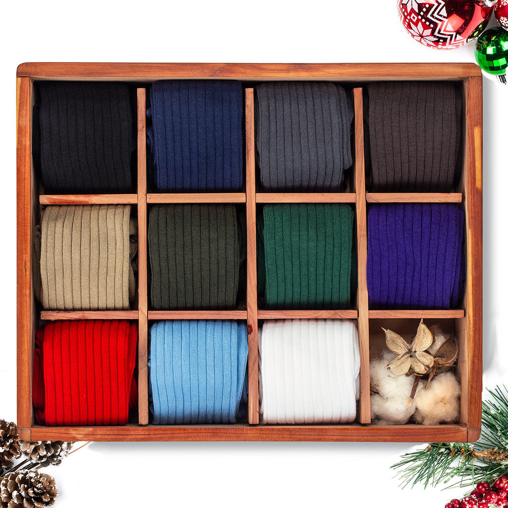 cedar box filled with eleven pairs of solid cotton dress socks