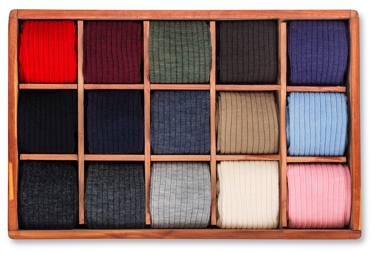 cedar box displaying 15 colors of solid merino wool dress socks