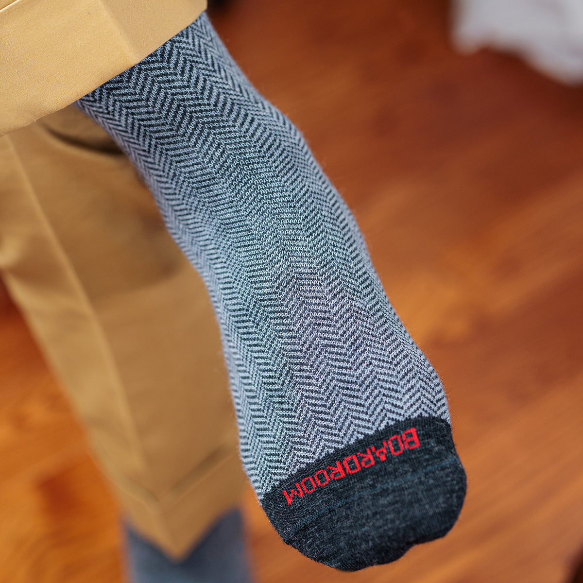 man wearing tonal grey herringbone men&#39;s dress socks with tan trousers