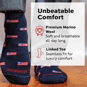 man standing wearing navy wool mid-calf socks with american flag repeating pattern