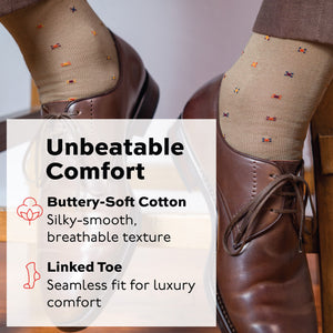 man sitting on a stool wearing khaki geometric pattern dress socks with an unbeatable comfort infographic overlay