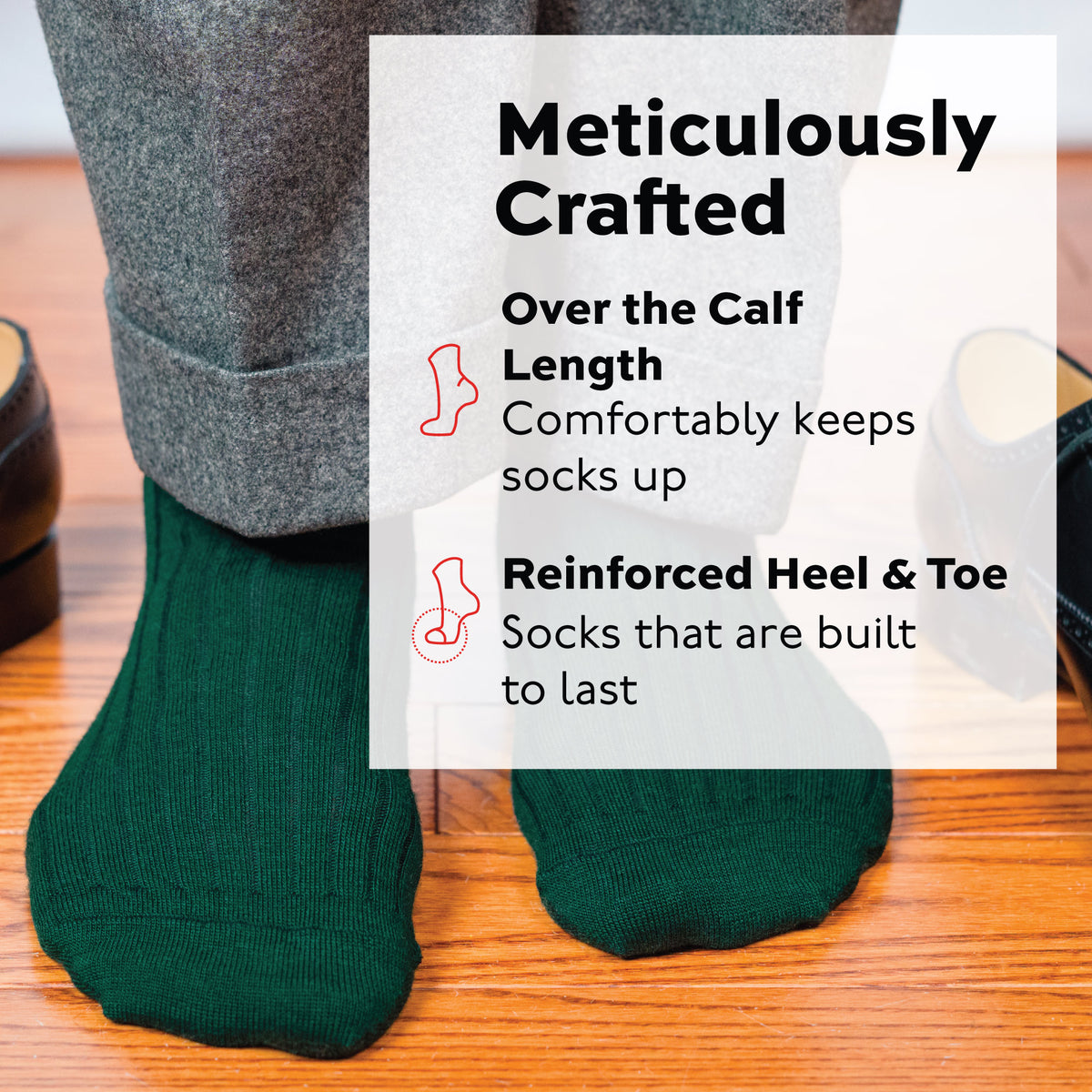 person wearing Forest Green Merino Wool Over the Calf Dress Socks and grey pants standing on wood flooring 
