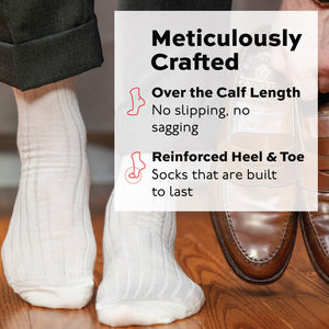 person wearing natural merino wool over the calf ribbed mens dress socks standing on hardwood floors