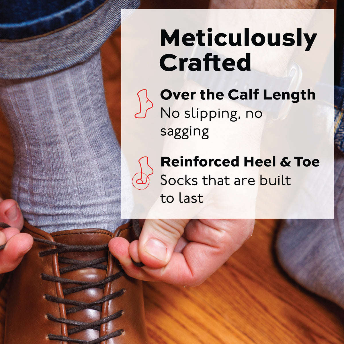 man tying his shoe wearing ight grey merino wool over the calf dress socks and jeans