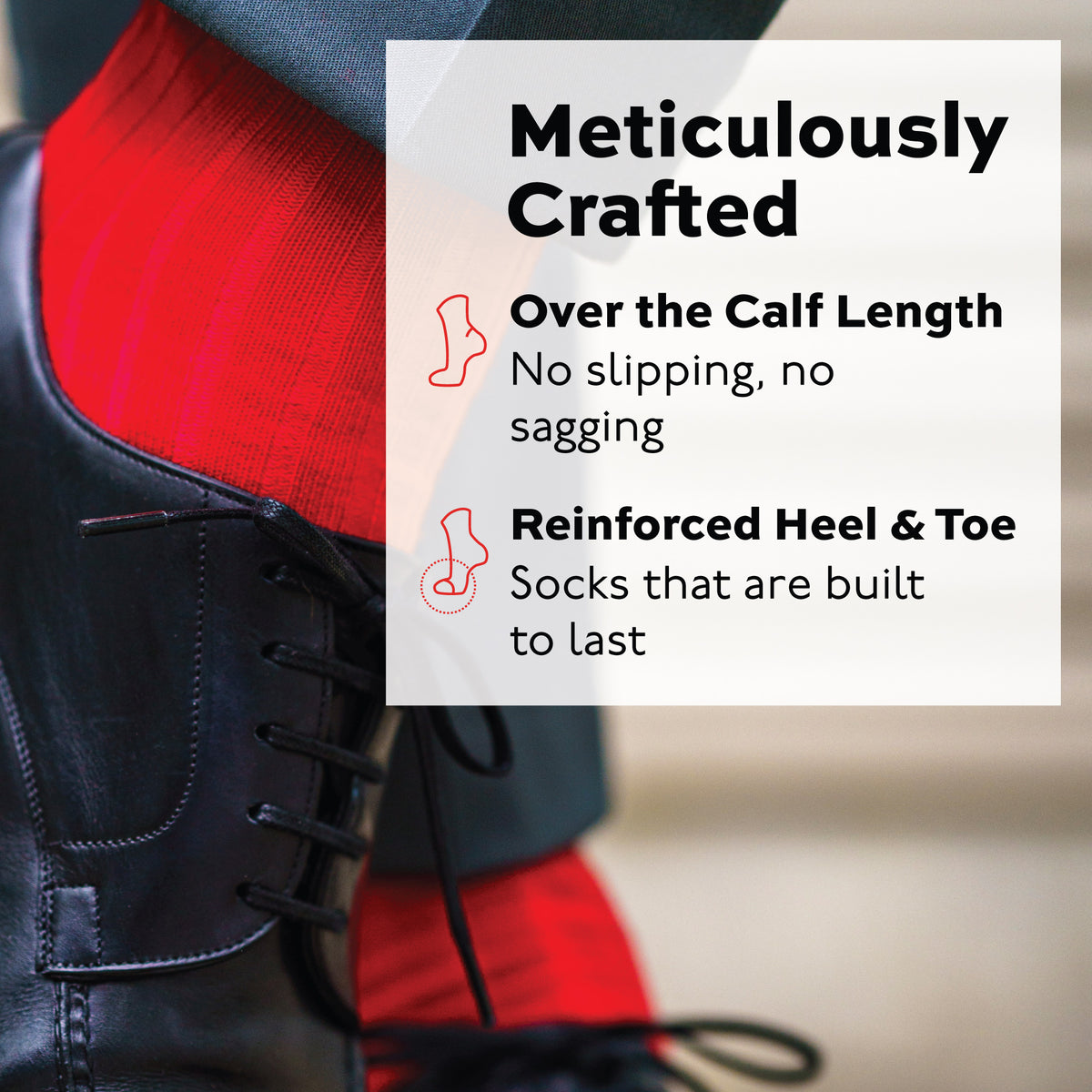 man crossing legs wearing red merino wool over the calf ribbed mens dress socks and black shoes