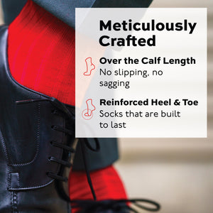 man crossing legs wearing red merino wool over the calf ribbed mens dress socks and black shoes
