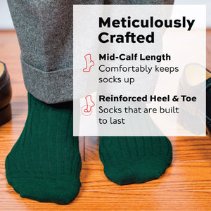 man standing on wood flooring wearing Forest Green Merino Wool mid-Calf Dress Socks and grey pants