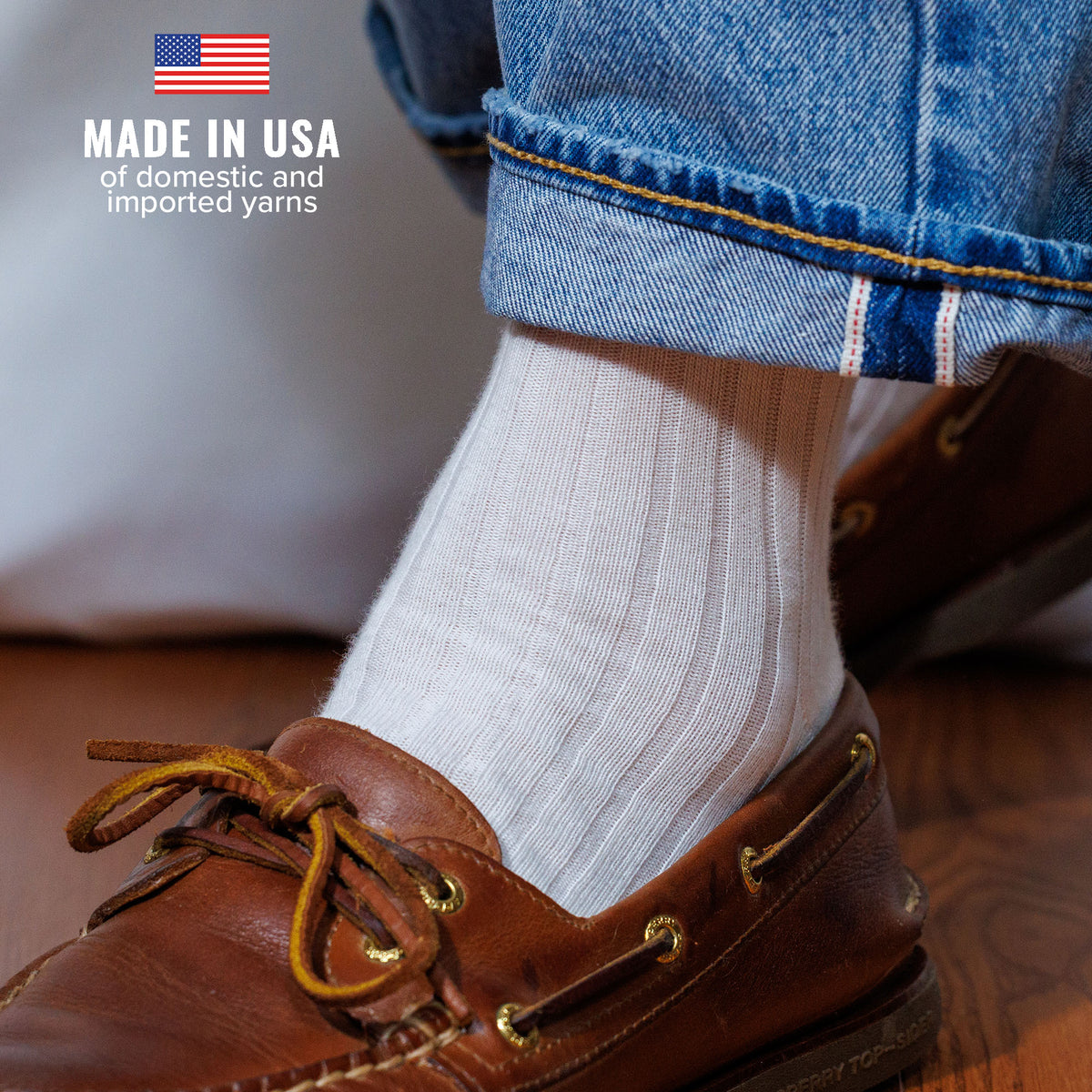 man wearing soft white cotton ribbed dress socks with light jeans and boat shoes
