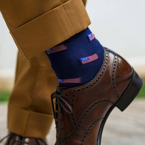 man crossing ankles wearing American flag dress socks