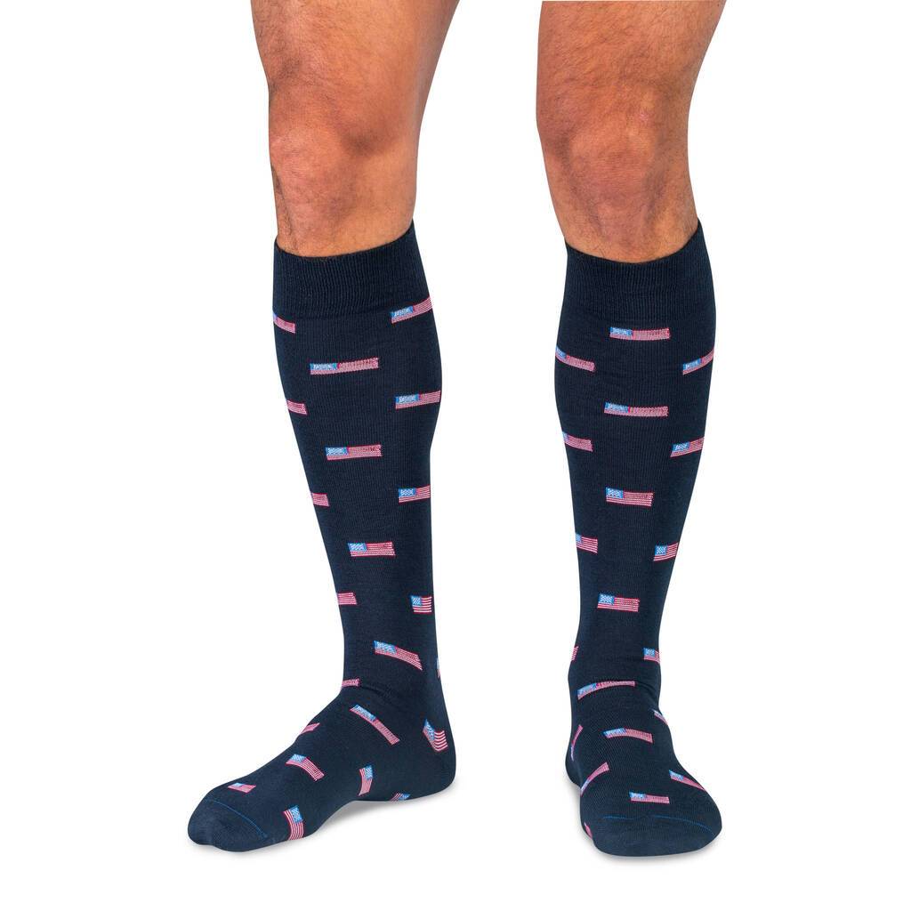 Model Wearing Navy Blue Over the Calf Dress Socks Decorated with Small American Flags