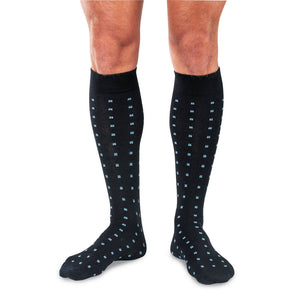 Man Wearing Black Wool Over the Calf Dress Socks Decorated with Small Blue Squares